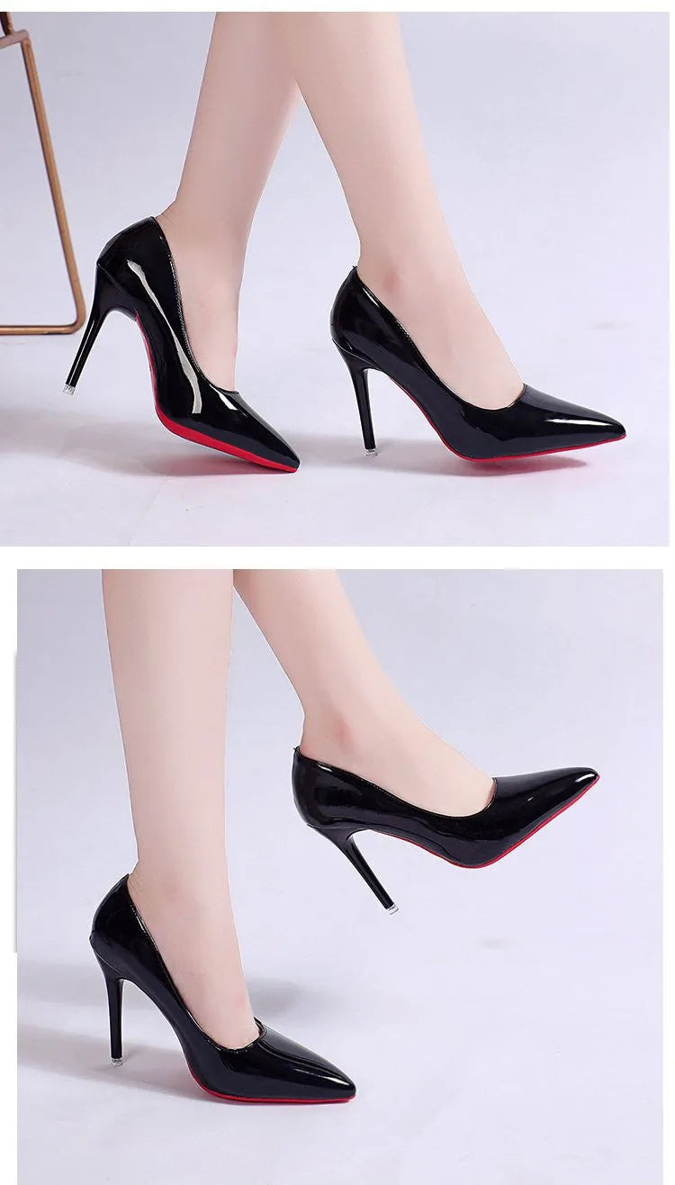Women's black stiletto heel pump with pointed toe and shallow mouth opening on a white background.