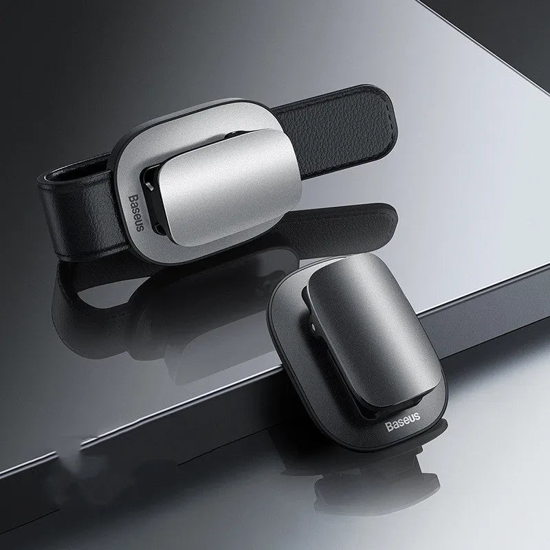 Baseus multifunction glasses frame in metal and ABS, holding glasses and documents on a desk.