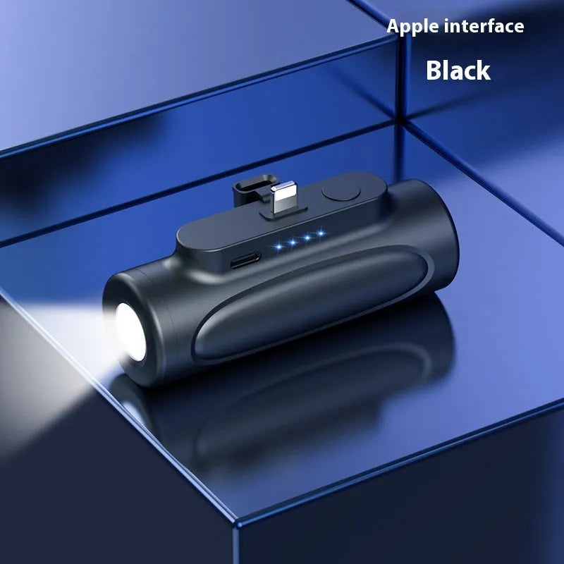 Black and pink portable power bank with integrated LED flashlight, showing USB-C and Apple port options.
