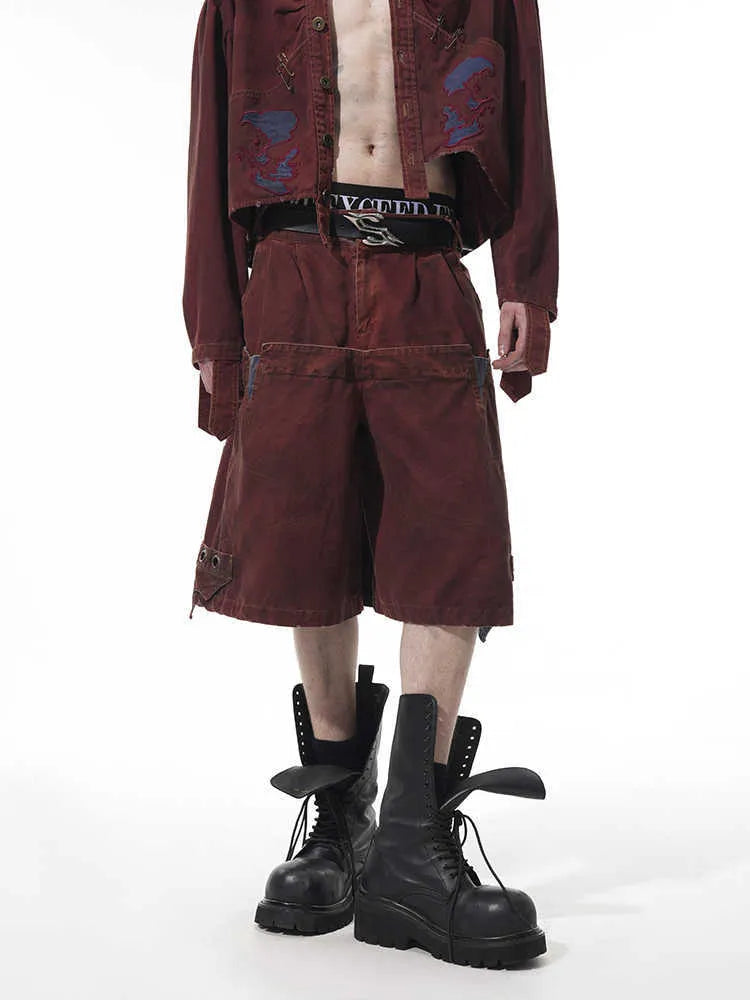 Men's black loose cropped trousers showing double waistband and washed stitching detail