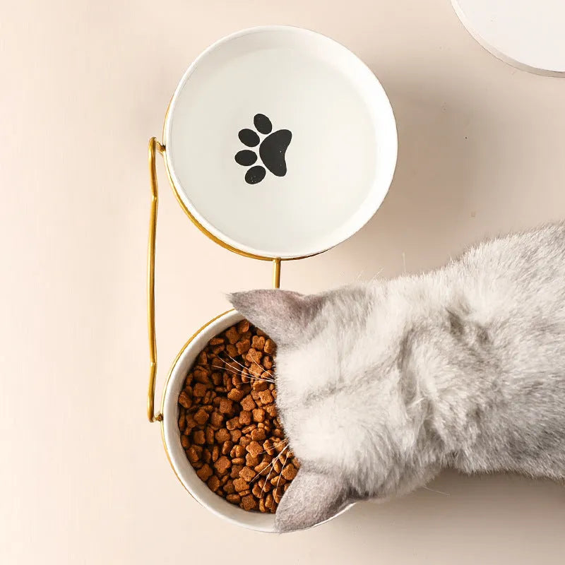 White ceramic cat bowl with decorative iron frame in cat ear design