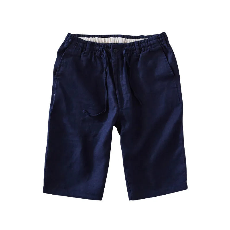 Men's loose-fitting linen capri trousers in a straight-leg style on a neutral background.