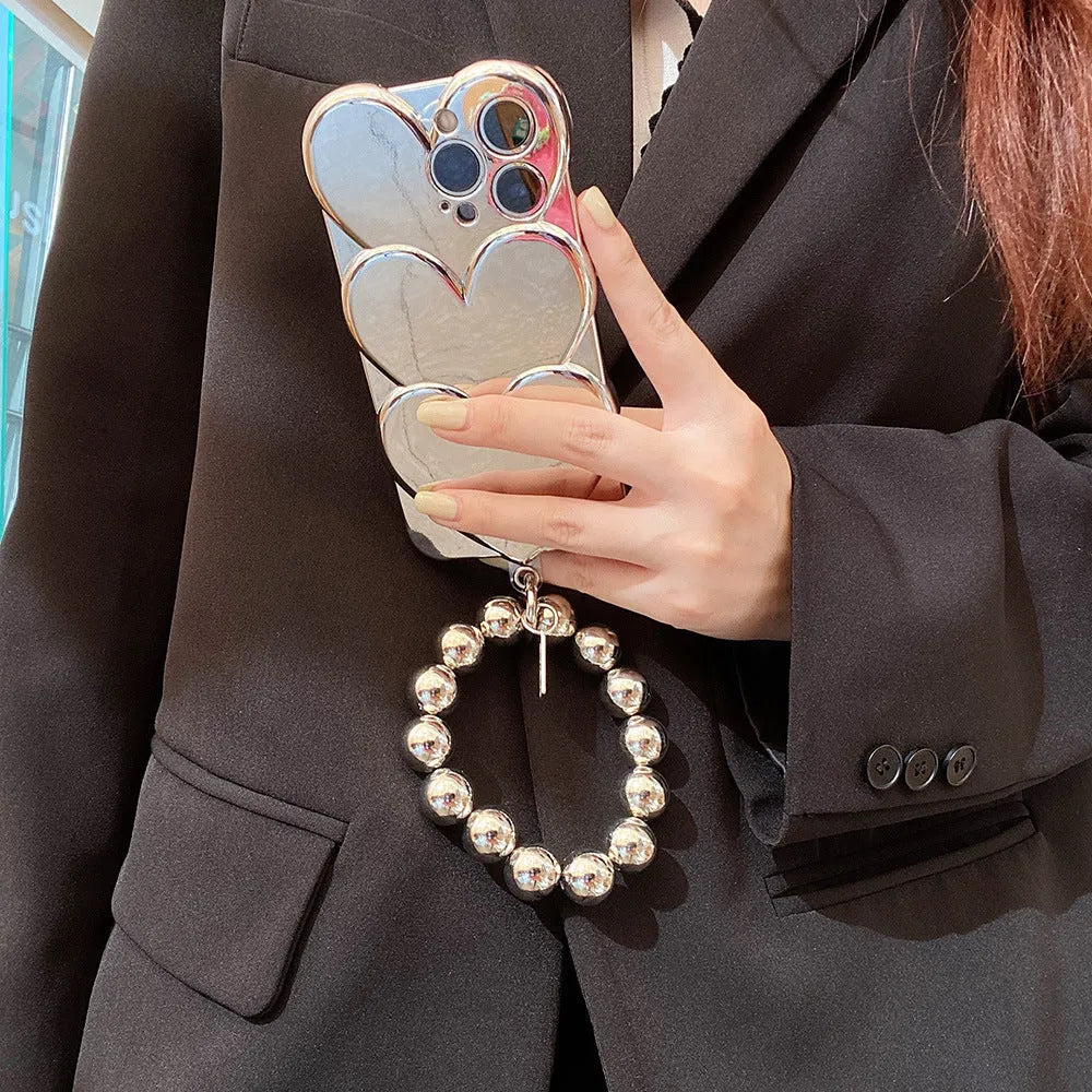 Electroplated love design TPU soft shell mobile phone case for iPhone, shown with optional matching bracelet.