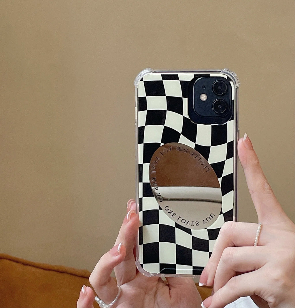 Mirror phone case with chessboard plaid pattern against black background