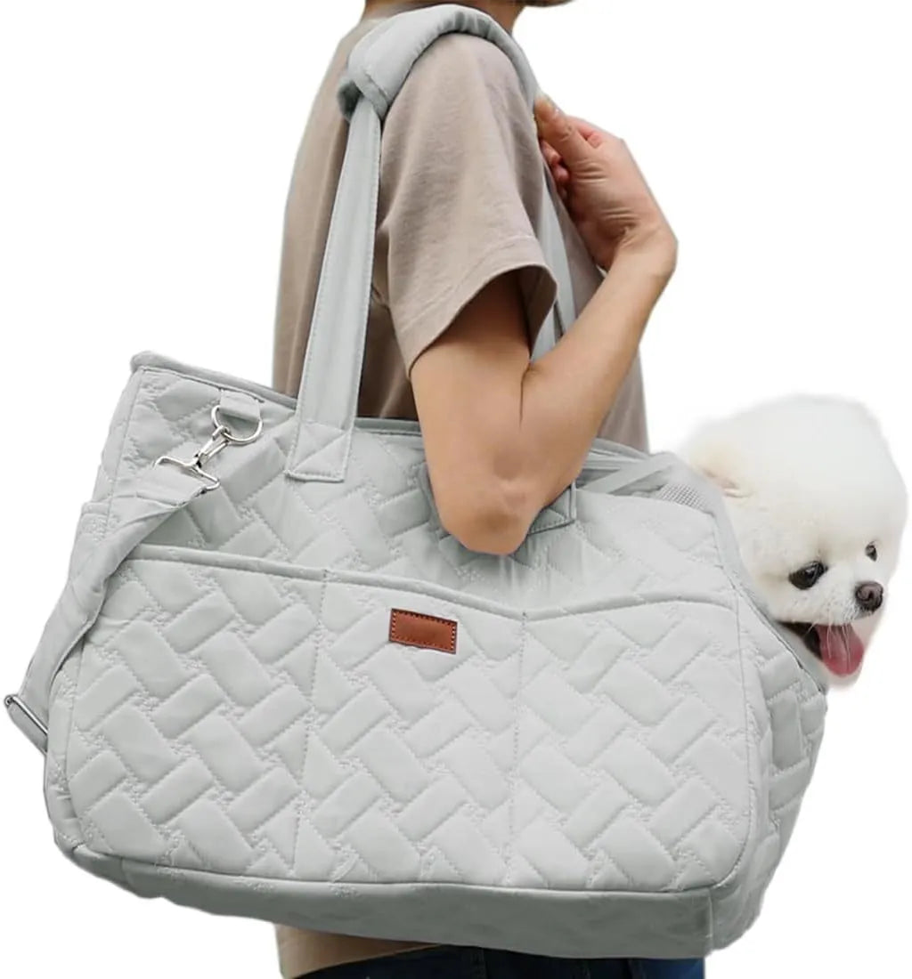 Grey handbag-style pet carrier for cats and small dogs with mesh panels and multiple pockets.