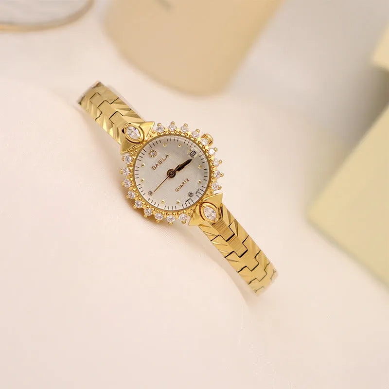 Women's quartz watch with diamond embossed bracelet in gold colour