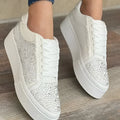 Women's black casual sports shoes with lace-up front, rhinestone detail, and thick rubber sole.