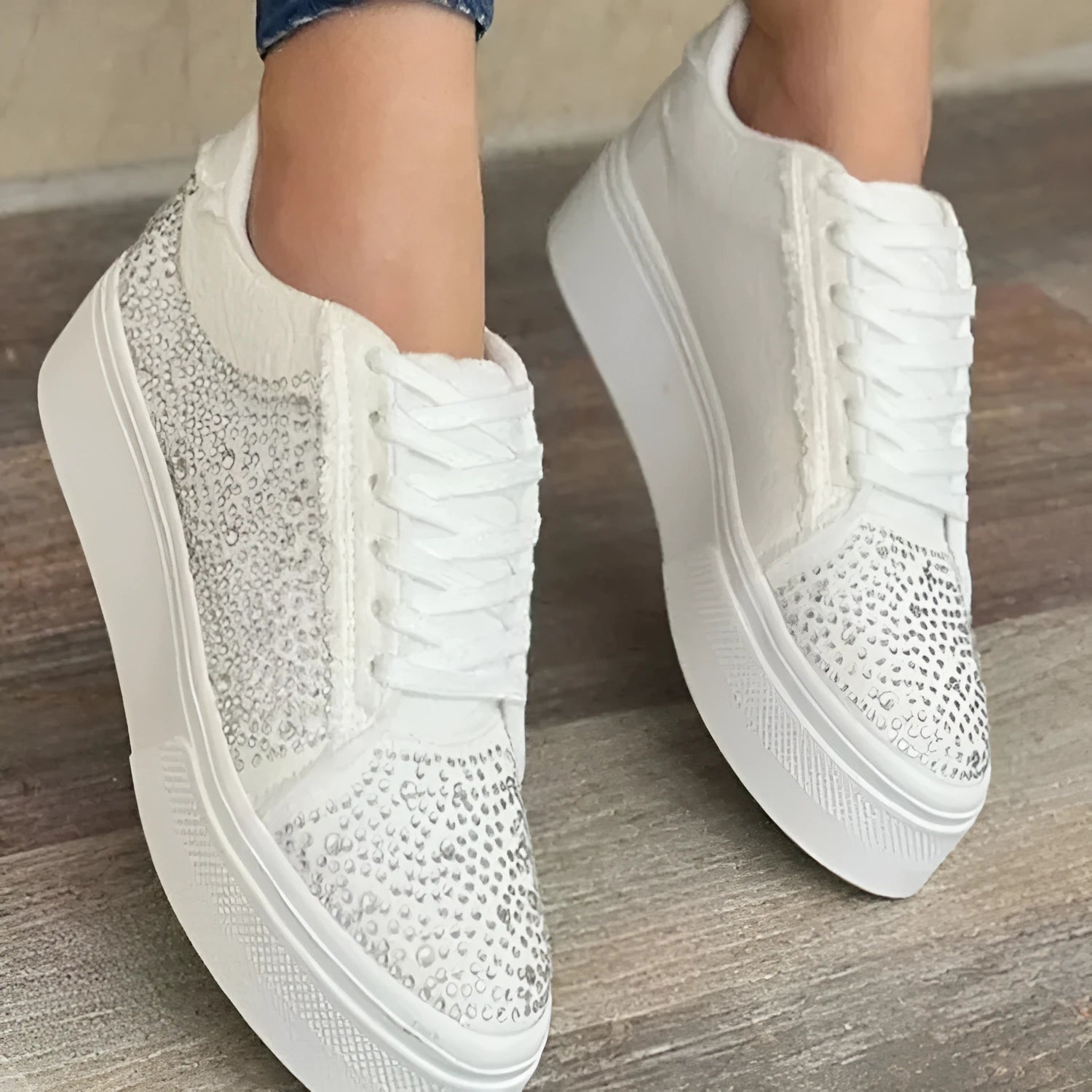 Women's black casual sports shoes with lace-up front, rhinestone detail, and thick rubber sole.