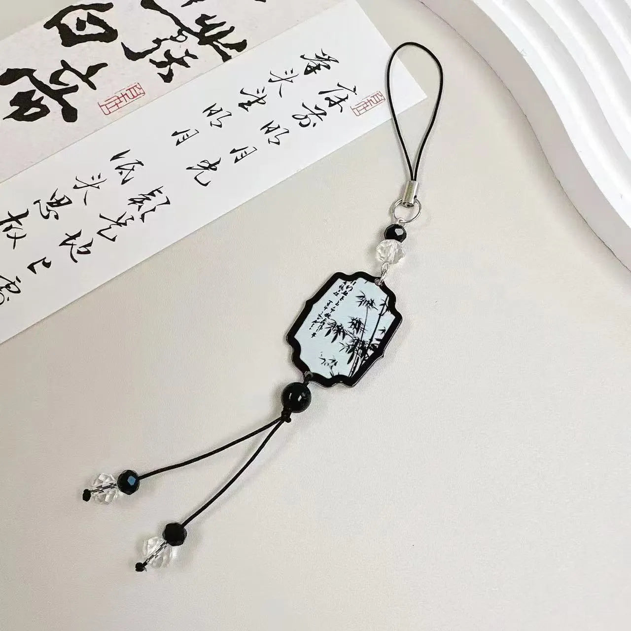 Guofeng style floral beaded keychain with baked varnish finish and metal ring.