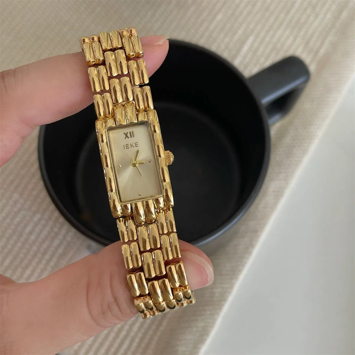 Women's mid-ancient style bracelet watch with spiral crown and mineral glass, available in gold and silver colour variations