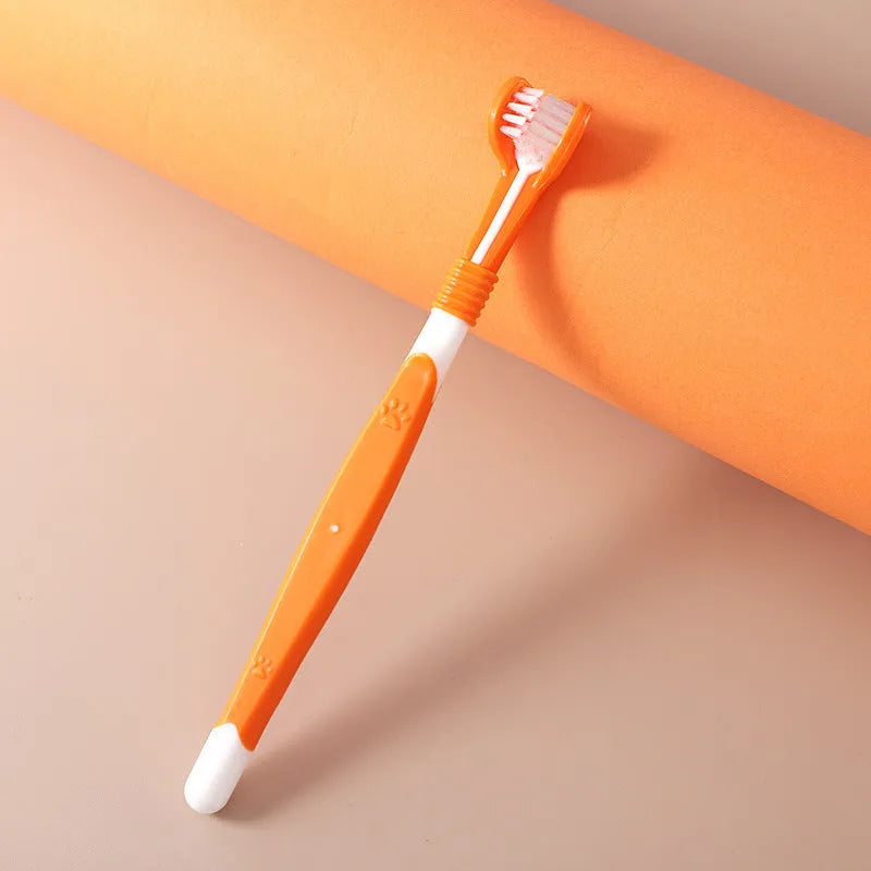 Pet toothbrush with nylon bristles and plastic handle in green colour