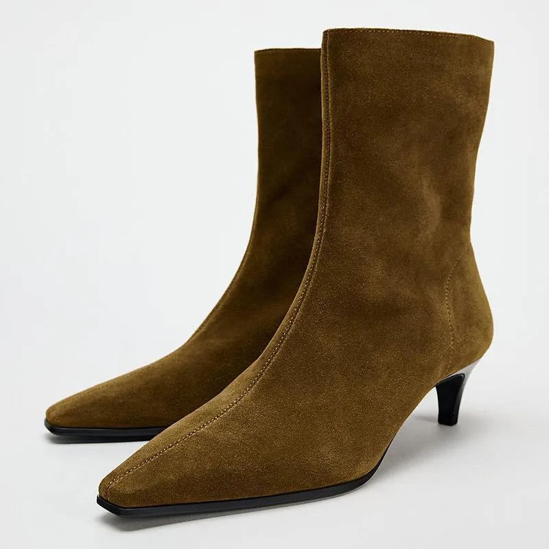 Brown square toe ankle boots with side zipper and kitten heels on a waterproof platform sole