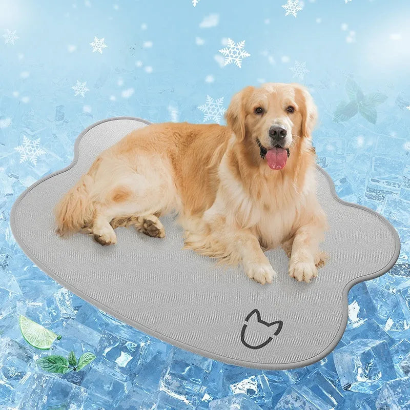Dog head shaped ice silk cooling mat for pets in grey, green or rice colours on a wooden floor