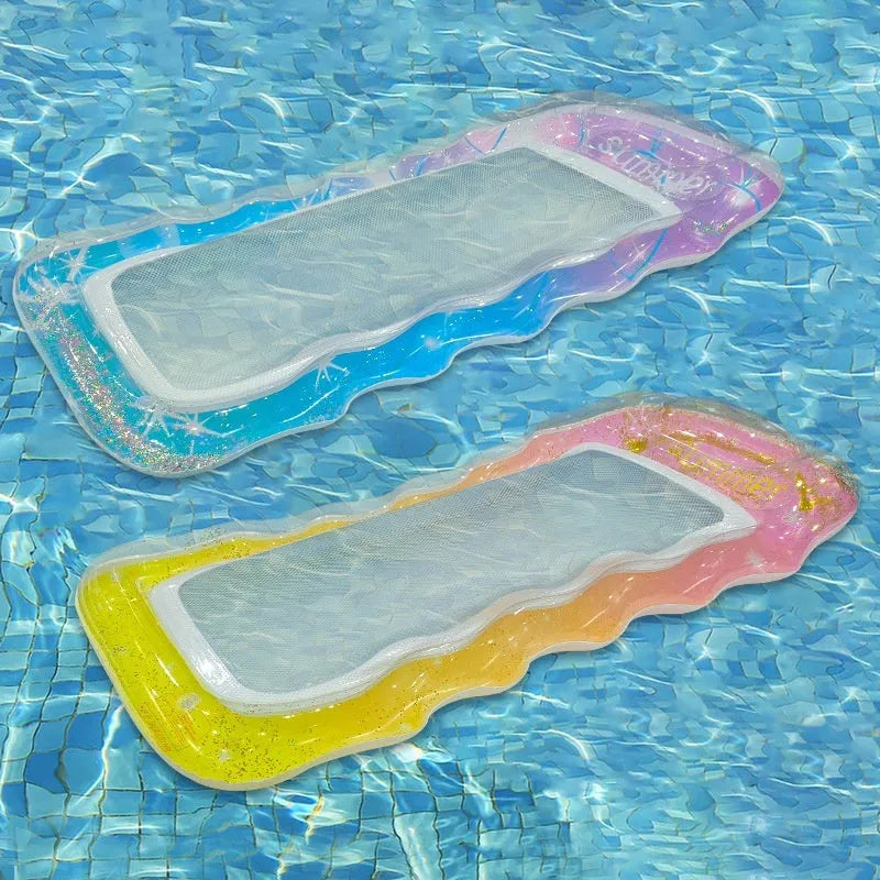 Inflatable floating row in sequined gradient colours on water, with canopy and mesh deck chair