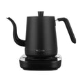 Black stainless steel slender mouth touch control electric kettle with inner scale marking on a desk
