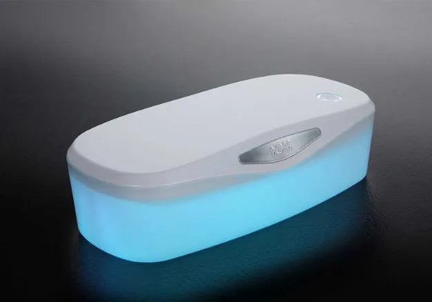 Compact white DORR UV disinfection box with USB cable for sanitising phones and small items.