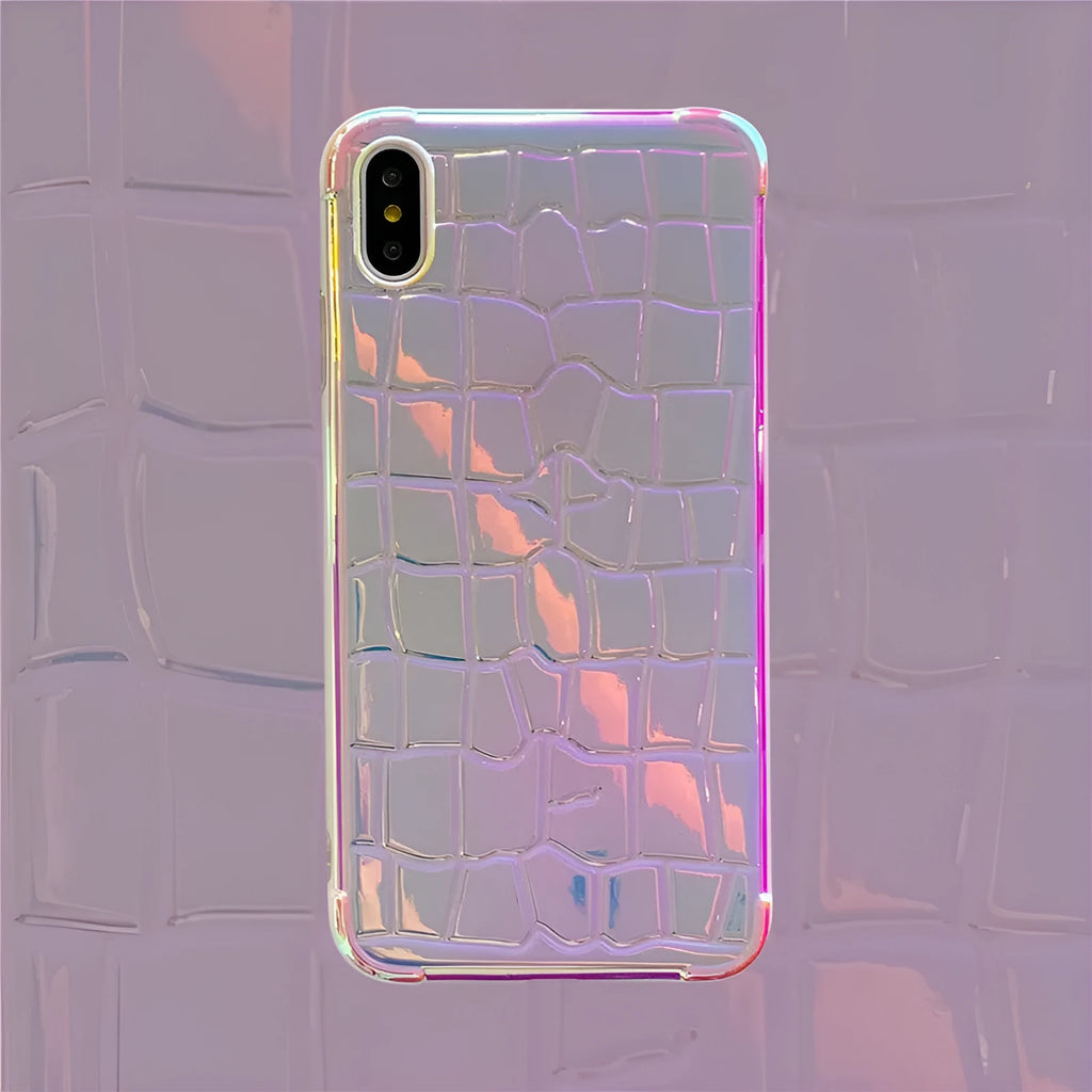 Glossy silver silicone phone case with a laser-etched irregular texture for iPhone, showing raised camera protection.