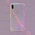 Glossy silver silicone phone case with a laser-etched irregular texture for iPhone, showing raised camera protection.