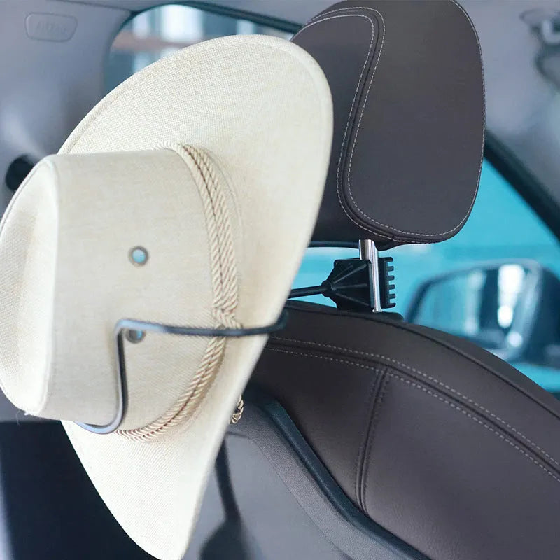Black metal snap-on hat bracket for car interior display stand holding a hat