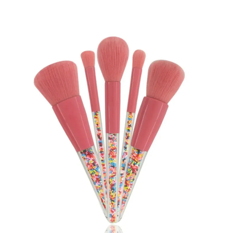 5 candy makeup brushes with colourful acrylic handles, fibre hair bristles, and aluminium ferrules on a white background