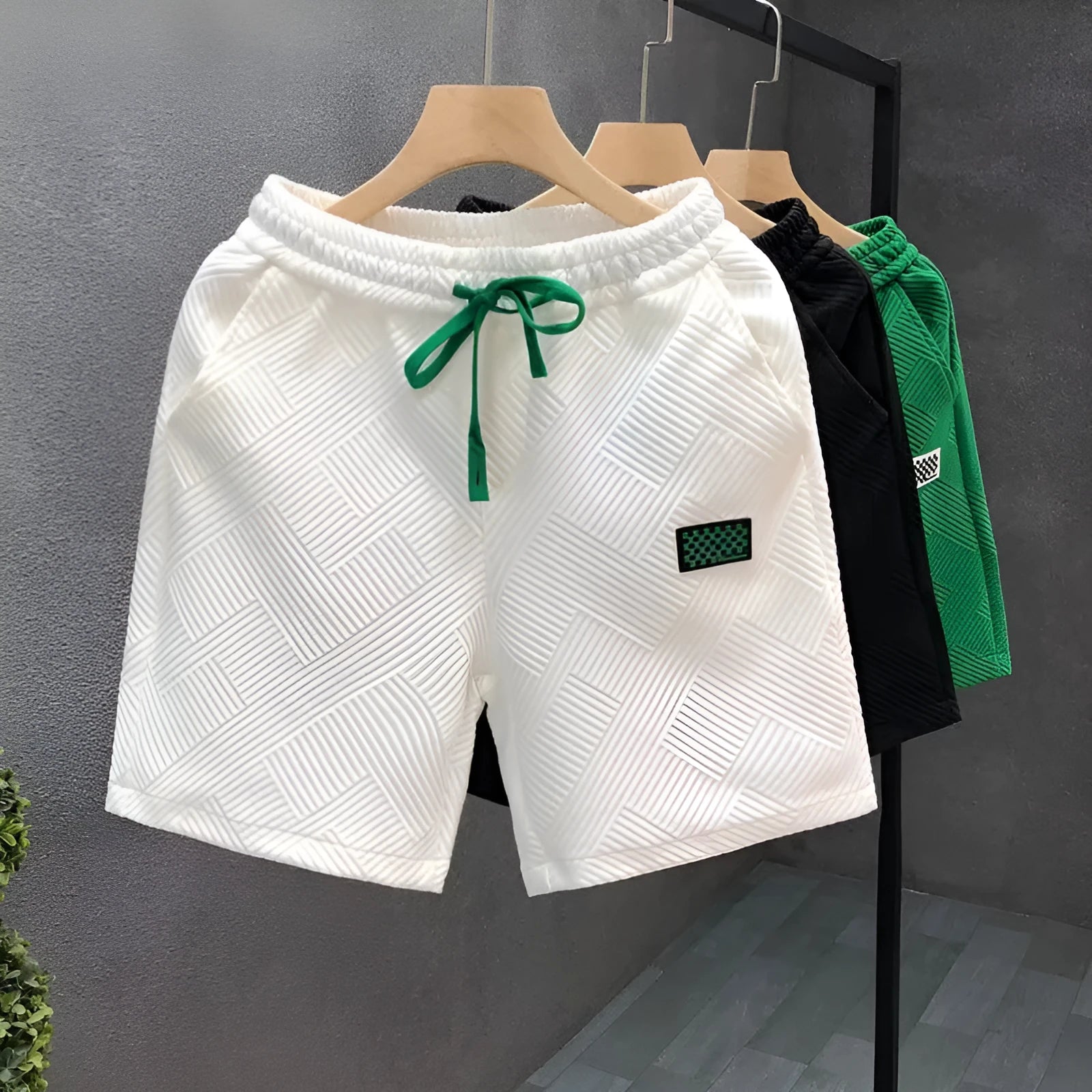 Men's casual sports shorts in polyester fabric showing elastic waistband and solid colour options