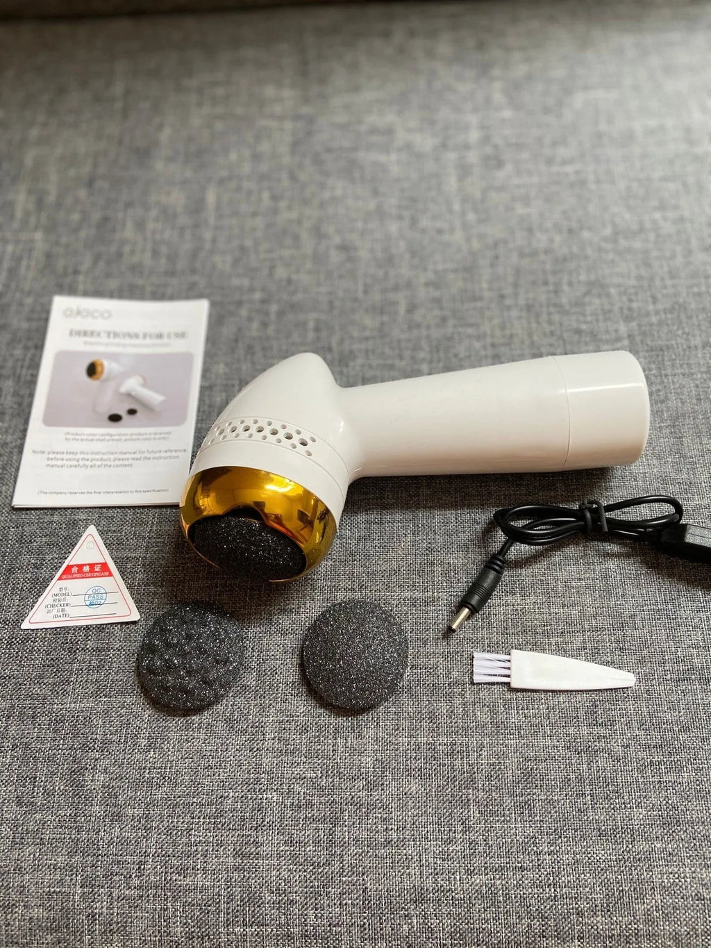 Electric vacuum foot grinder with refined quartz head in gold finish for gentle cuticle removal
