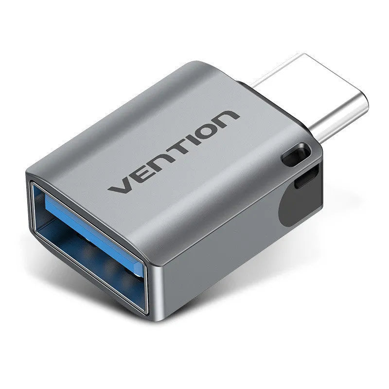 Grey aluminium USB 3.0 OTG adapter with USB-C male and USB-A female connectors and a lanyard.
