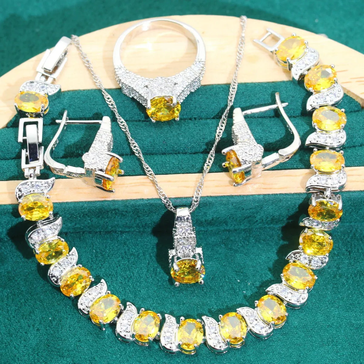 Bridal zircon alloy jewellery four-piece set showing necklace, earrings, ring and bracelet on water wave chain