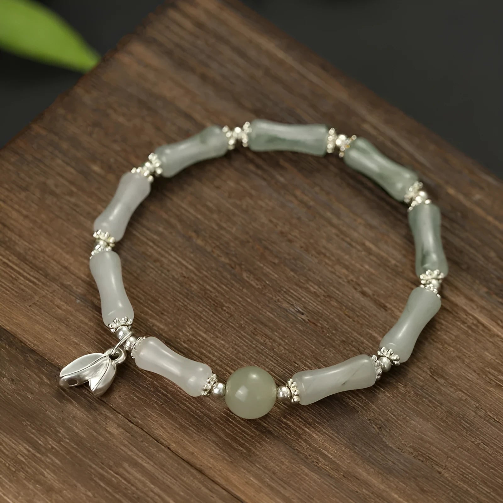 Natural Tianshan green bamboo and sterling silver antique-style bracelet for women with a bamboo joint motif.
