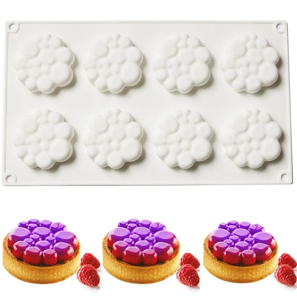 Round silicone cake mould with 8 raised bubble towers for tiered desserts.