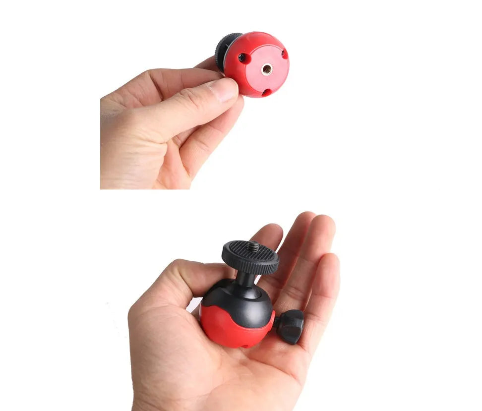 Black octopus tripod with eight flexible rubber legs and a spherical gimbal head for mounting cameras and phones.