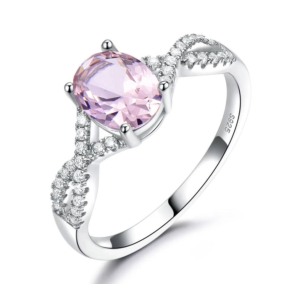 Sterling silver ring with oval nano morganite stone in round shape, available in multiple colours on white background