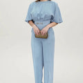 Blue men's two-piece polyester suit set with long-sleeved jacket and trousers on a hanger.