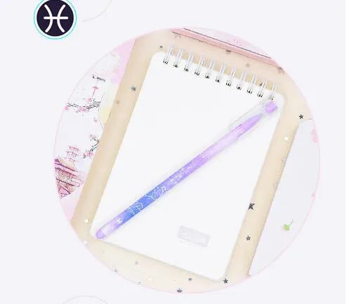 Box of 12 plastic gel pens with quick-drying ink and constellation-themed designs in assorted colours