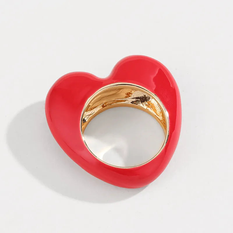Three-dimensional enamel heart ring in zinc alloy showing raised design detail