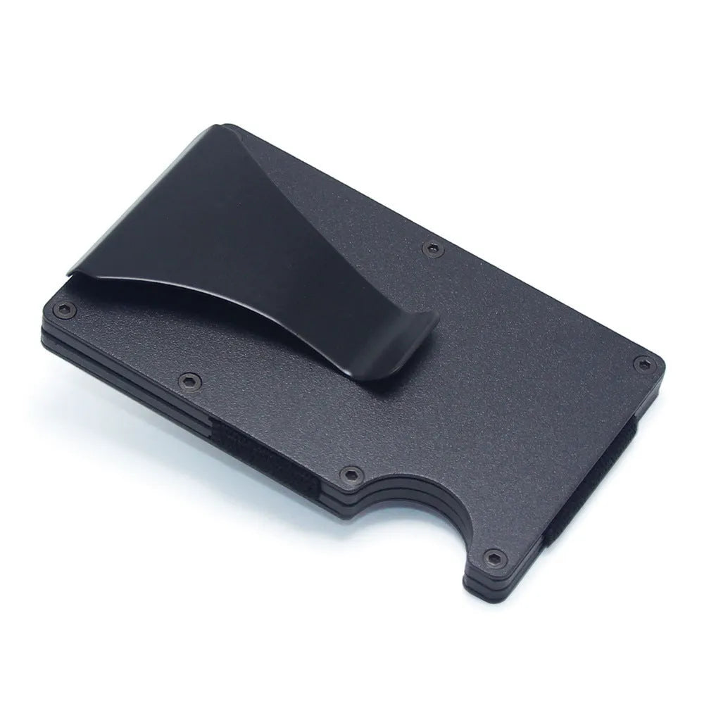 A slim carbon fibre card holder wallet in a geometric design, shown with business cards.