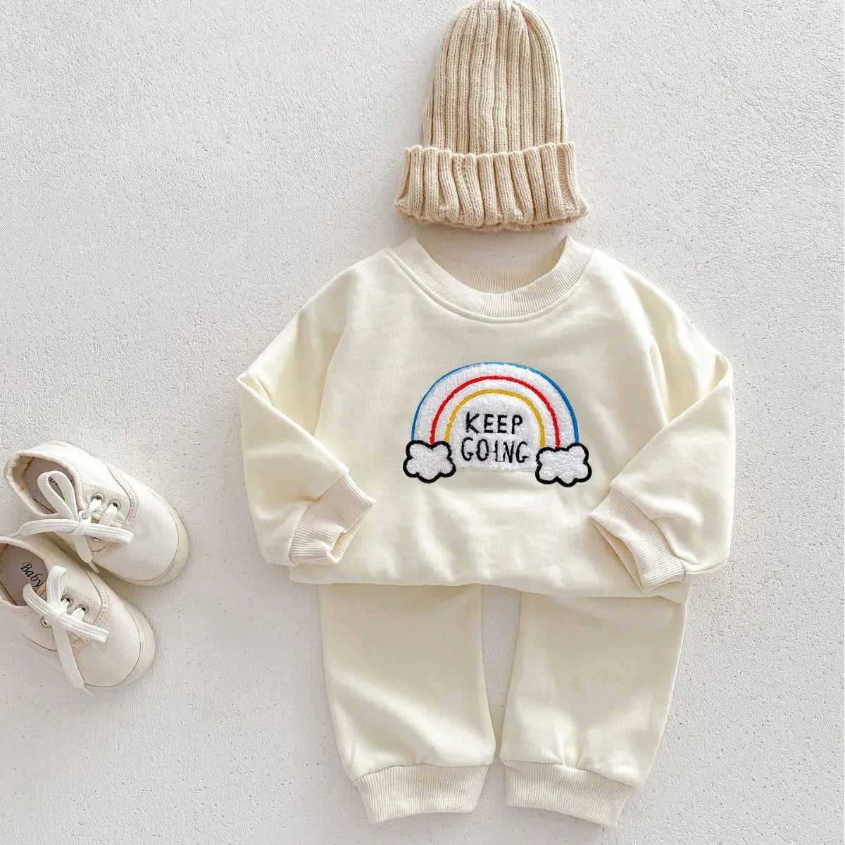 Children's rainbow sweater two-piece set in beige with cartoon and flower patterns, cotton pullover top and trousers for toddlers