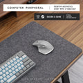 Felt cork desk mat in black gray pattern on a wooden desk with a mouse and keyboard
