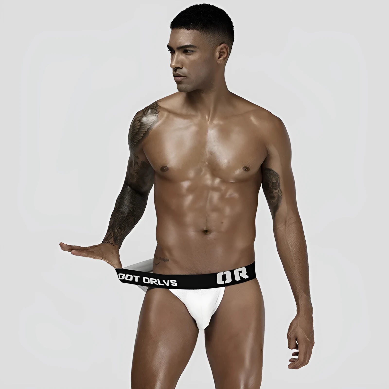 Men's low-waist mesh nylon briefs in black with body shaping and hip lifting support