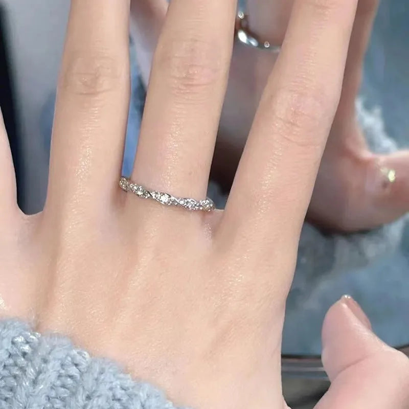 S999 sterling silver winding love ring in white gold colour with inlaid zircon for women