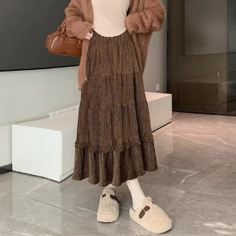 Korean style A-line corduroy skirt with elastic waistband in beige colour showing midi length