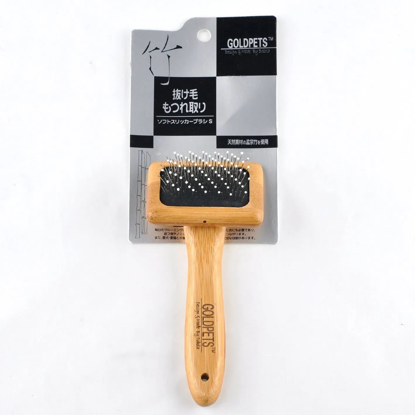 Pet grooming bamboo wood air cushion needle comb with original bamboo colour handle and steel pins on a clean background