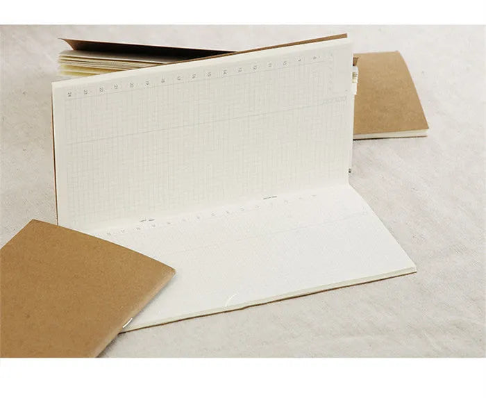 Cowhide diary refill inner core showing saddle stitch binding and 100g ivory white paper