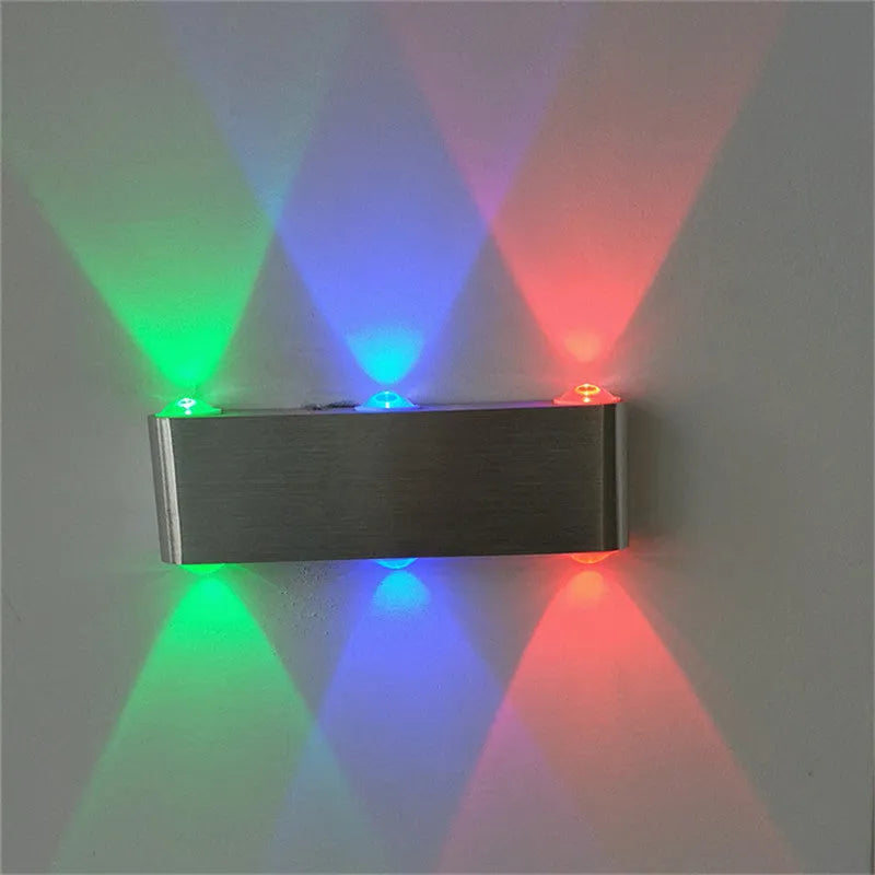 Silver aluminium rectangular LED wall lamp with multicolour lighting options on bedroom wall
