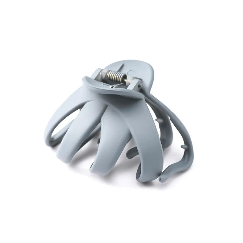 Children's plastic hair clip in small size available in green, dark blue, wine red, black, dark pink, and blue gray.