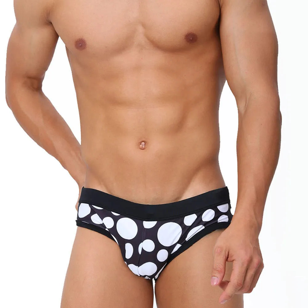 Men's triangle printed swimming trunks with cups, black ribbon cup design, polyester fabric, front view