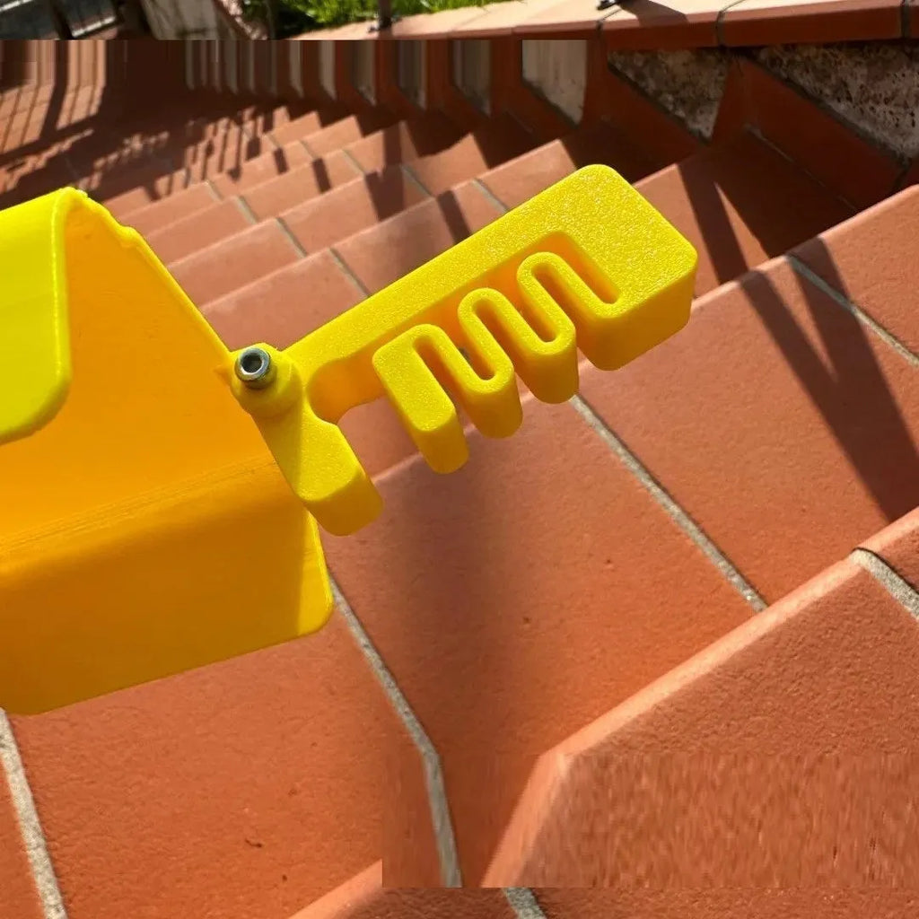 Yellow and black plastic beach phone sunshade holder with a clip for outdoor use.