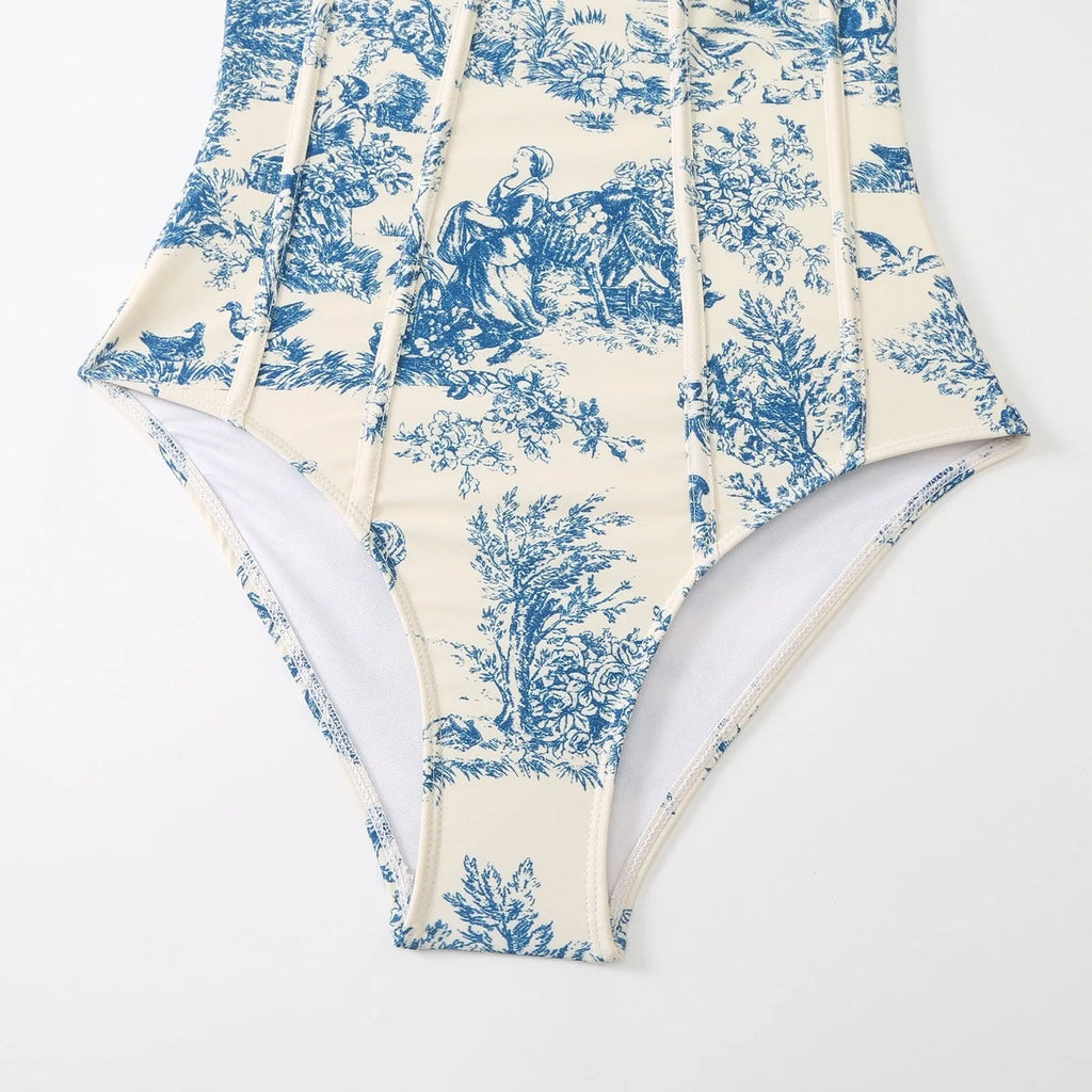 Blue women's one-piece swimsuit with matching gauze skirt on a model