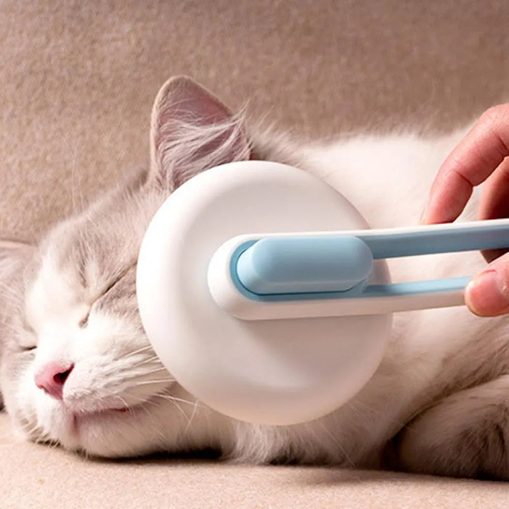 Blue automatic pet hair remover comb with stainless steel teeth and a button on the handle.