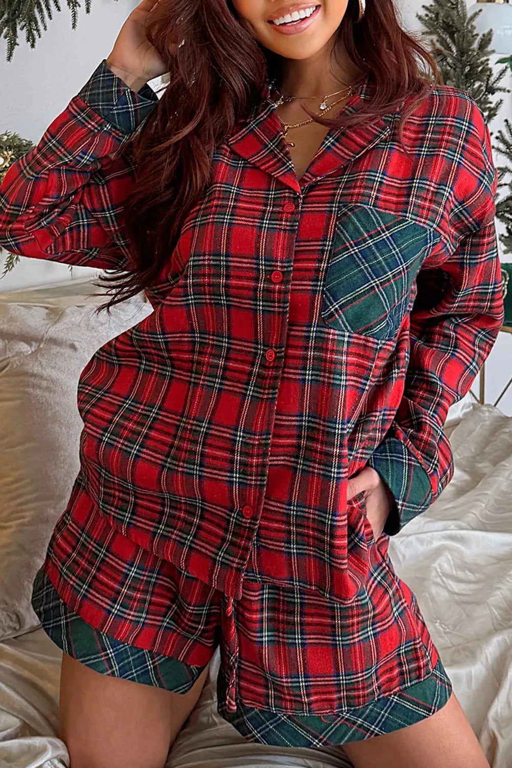 Red plaid Christmas pyjama set with long sleeve shirt and shorts featuring contrast patch details